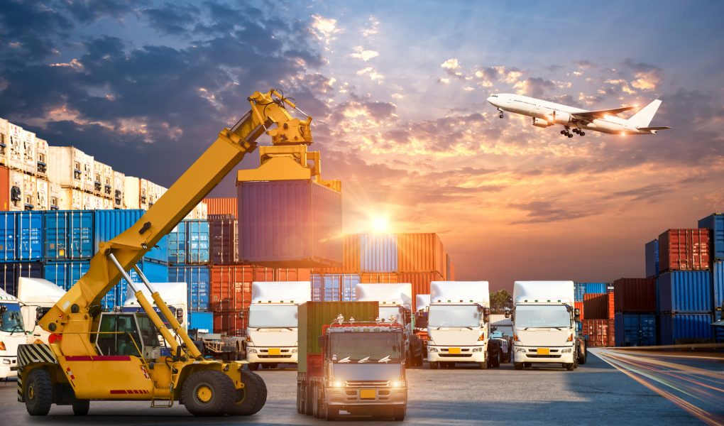 Business Logistics and transportation concept of Container Cargo ship and Cargo plane with working crane bridge in shipyard at sunrise, logistic import export and transport industry background Business Logistics and transportation concept of Container Cargo ship and Cargo plane with working crane bridge in shipyard at sunrise, logistic import export and transport industry background (Business Logistics and transportation concept of Containe